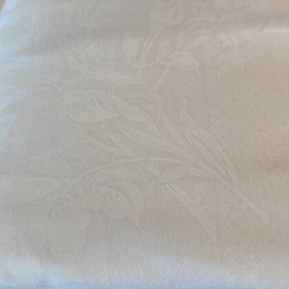 Close-up of the Ralph Lauren Hennessey Jacquard king fitted sheet showing the intricate white-on-white floral pattern woven into soft 100% cotton.
