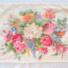 Top down closeup of Ralph Lauren Melissa on White pillowcase without pillow showing detailed floral design of peonies roses and wildflowers on crisp white cotton