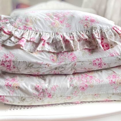 Pair of retired Simply Shabby Chic “Blush Beauty Bouquet” pillowcases stacked with ruffled sham, soft pink floral pattern on white background – romantic, cottagecore, vintage-inspired bedding
