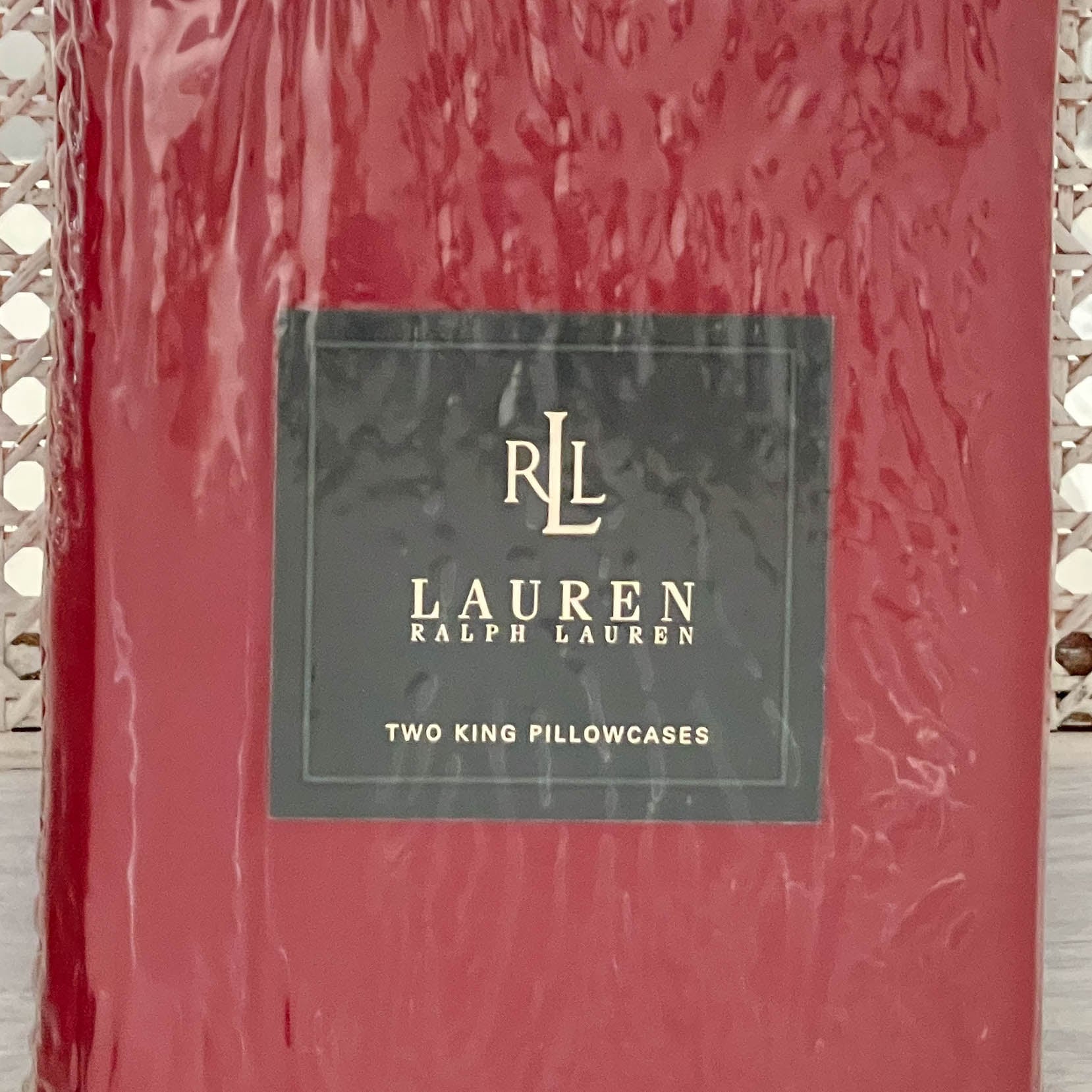 Close-up of the Ralph Lauren Lauren’s Solid barn red king flat sheet in original packaging.