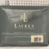 Close-up of the original packaging for the Ralph Lauren Lauren’s Solid barn red king flat sheet showing the barcode label with product details.