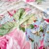 Tight close-up of Ralph Lauren Water Floral Pink comforter showcasing painterly floral design inspired by Impressionist artwork