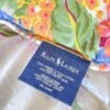 Top down view of Ralph Lauren Home blue tag on Melissa on White king comforter showing stitching and fabric detail