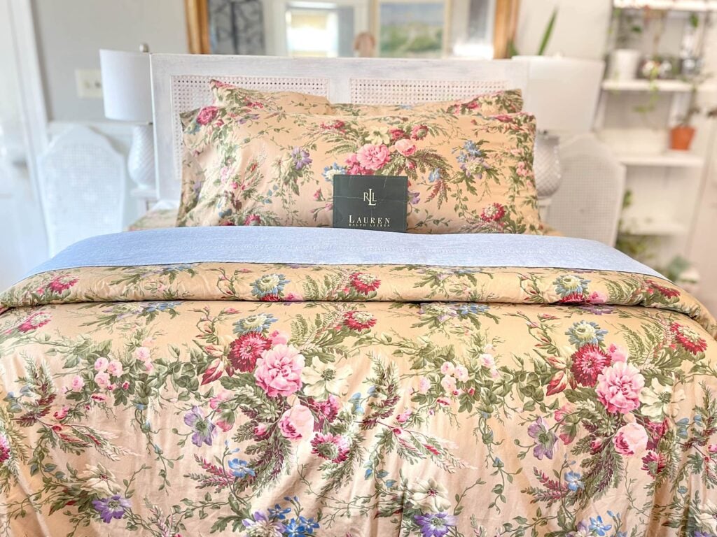 Front view of bed made with Ralph Lauren Adriana Floral king comforter and sheets in English Country style.