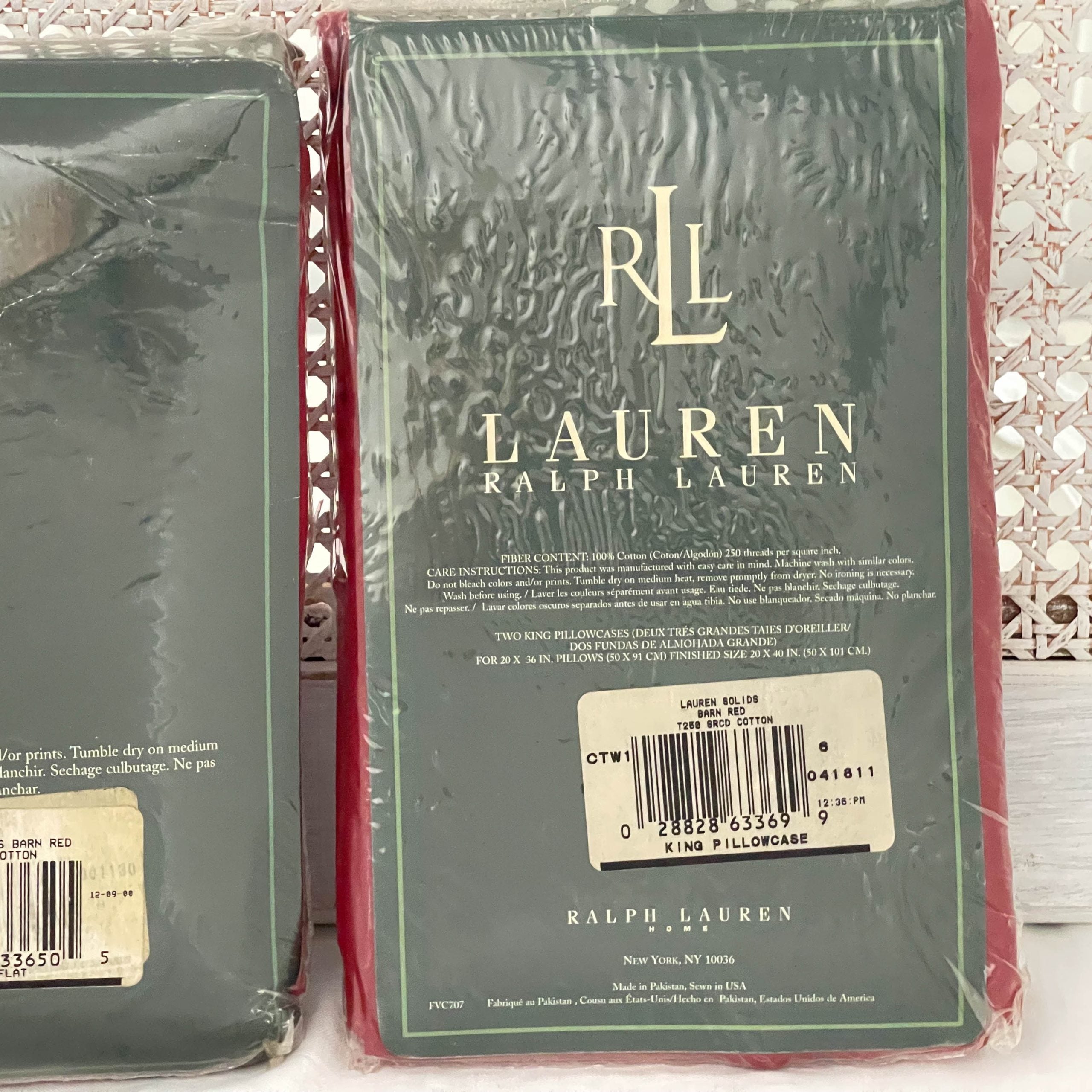 Close-up of the back side of the Ralph Lauren Lauren’s Solid barn red king pillowcase packaging showing the barcode label with product details.