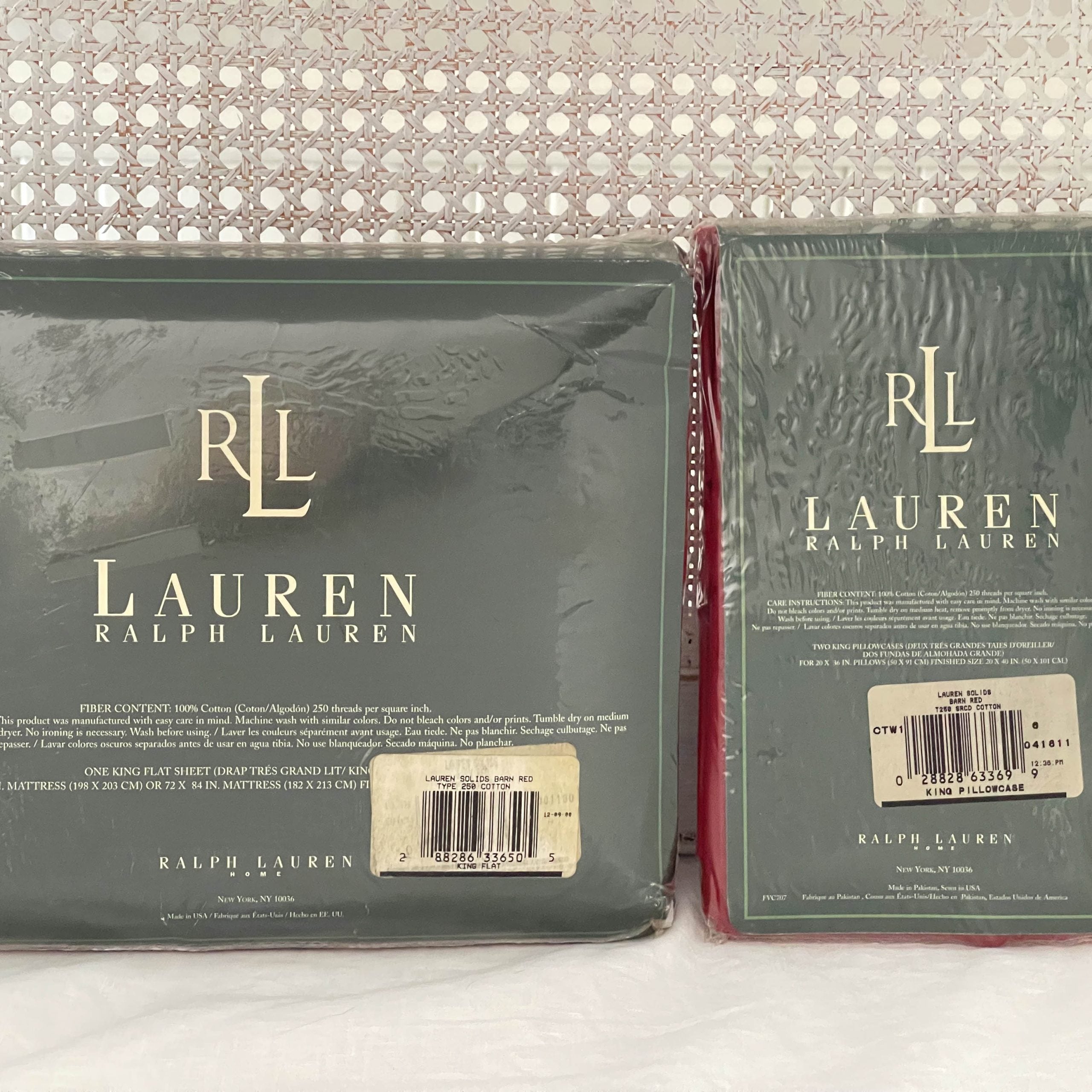 Back view of the Ralph Lauren Lauren’s Solid barn red king flat sheet and king pillowcases in original packaging with both barcode labels visible.