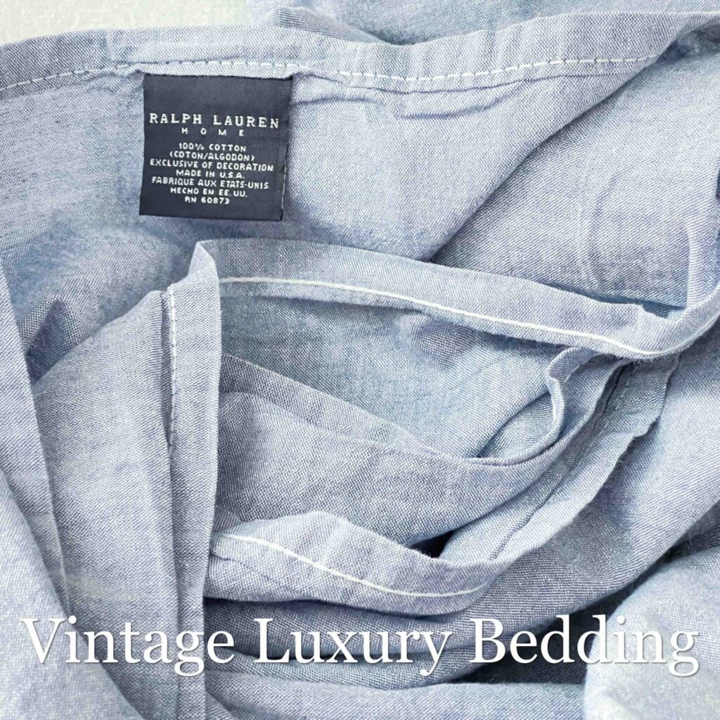 Rumpled Polo Ralph Lauren denim sheet top-down shot with navy Ralph Lauren tag visible