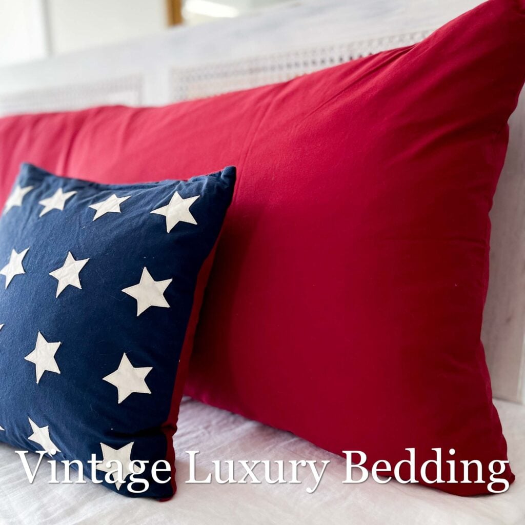 Side view of Ralph Lauren Barn Red pillowcase with Americana accent pillow