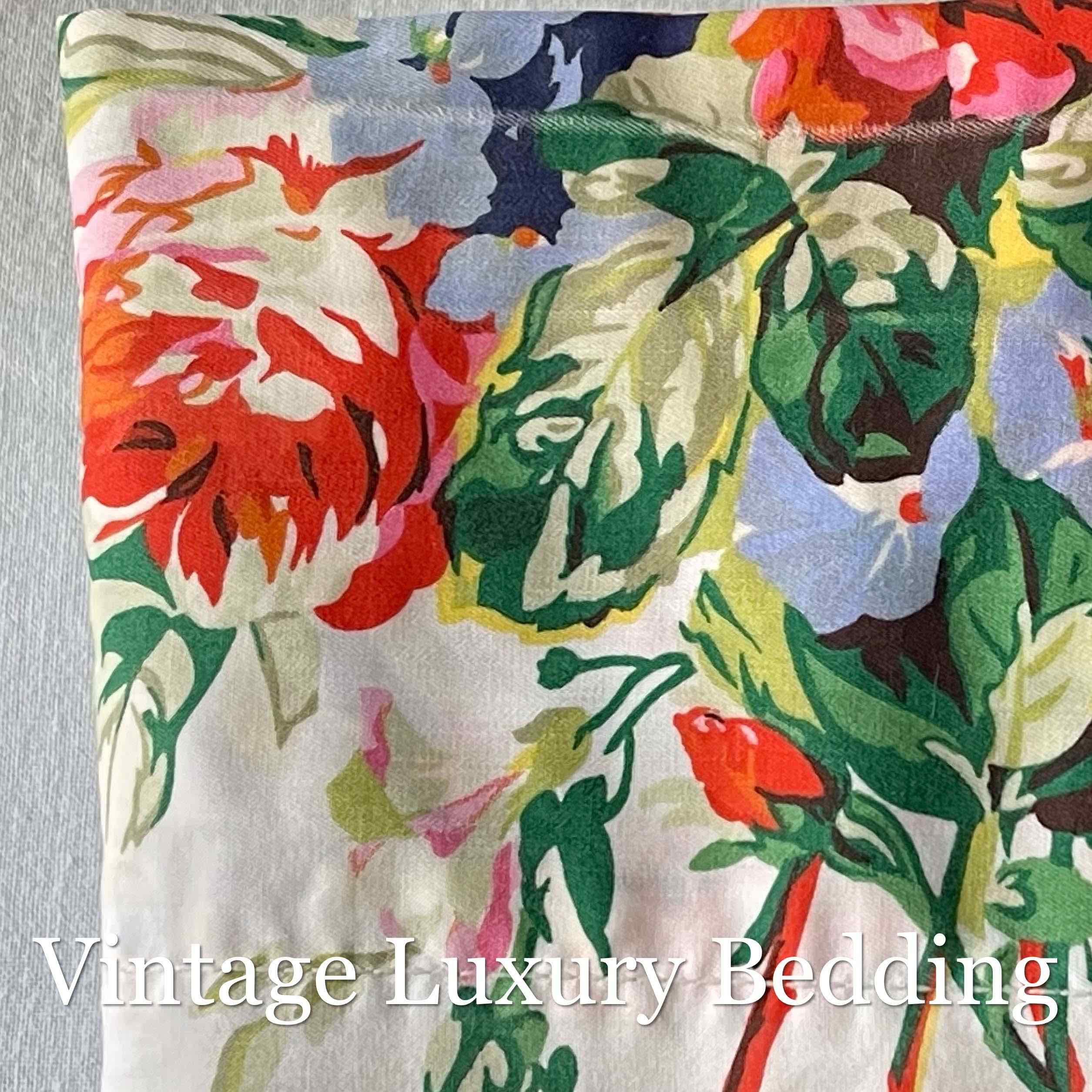 Ultra close-up of the Ralph Lauren Belle Harbor floral print showing detailed pink and red peonies with multicolor wildflowers on a soft white background.