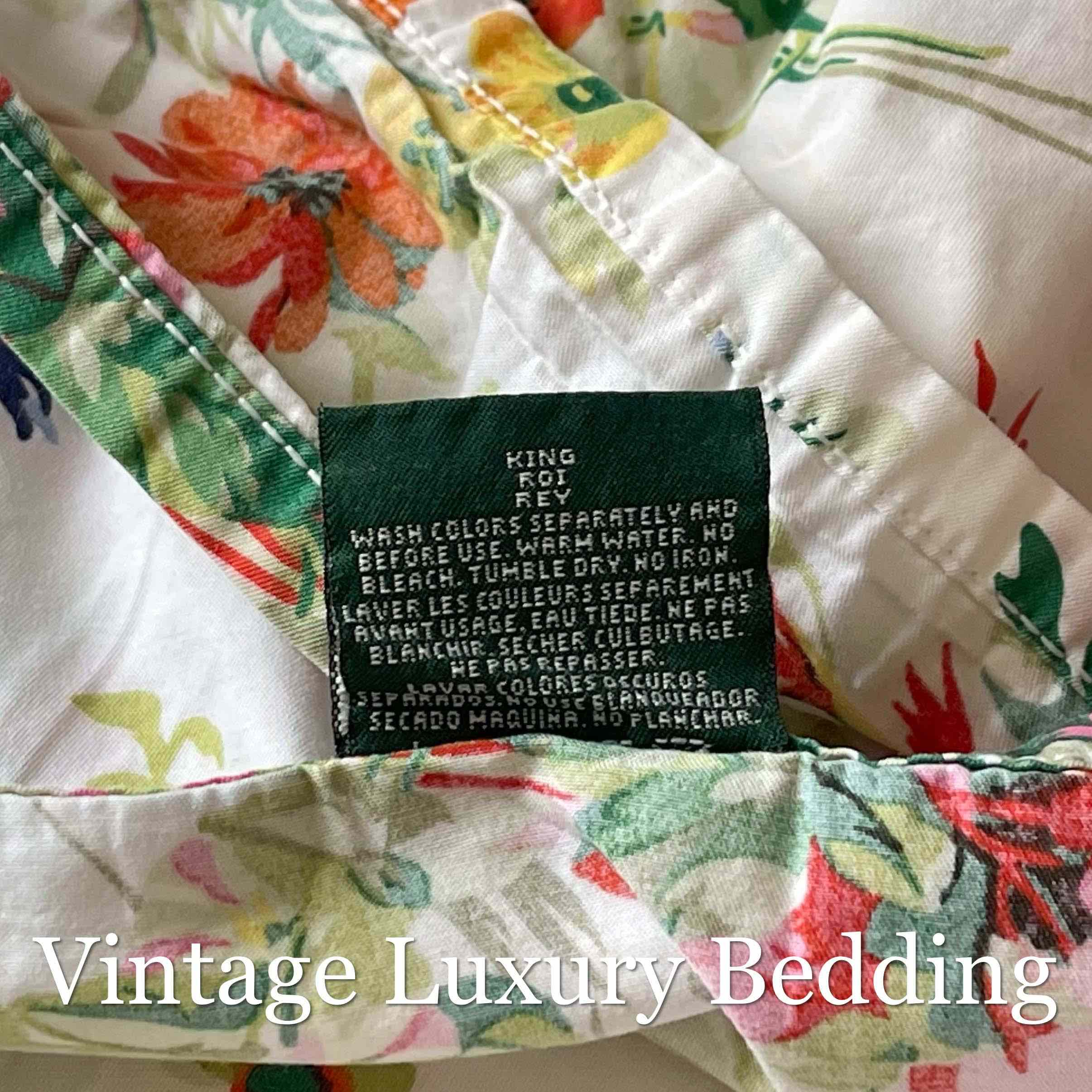 Top-down shot of the Ralph Lauren tag on the Belle Harbor king flat sheet against the colorful floral print.