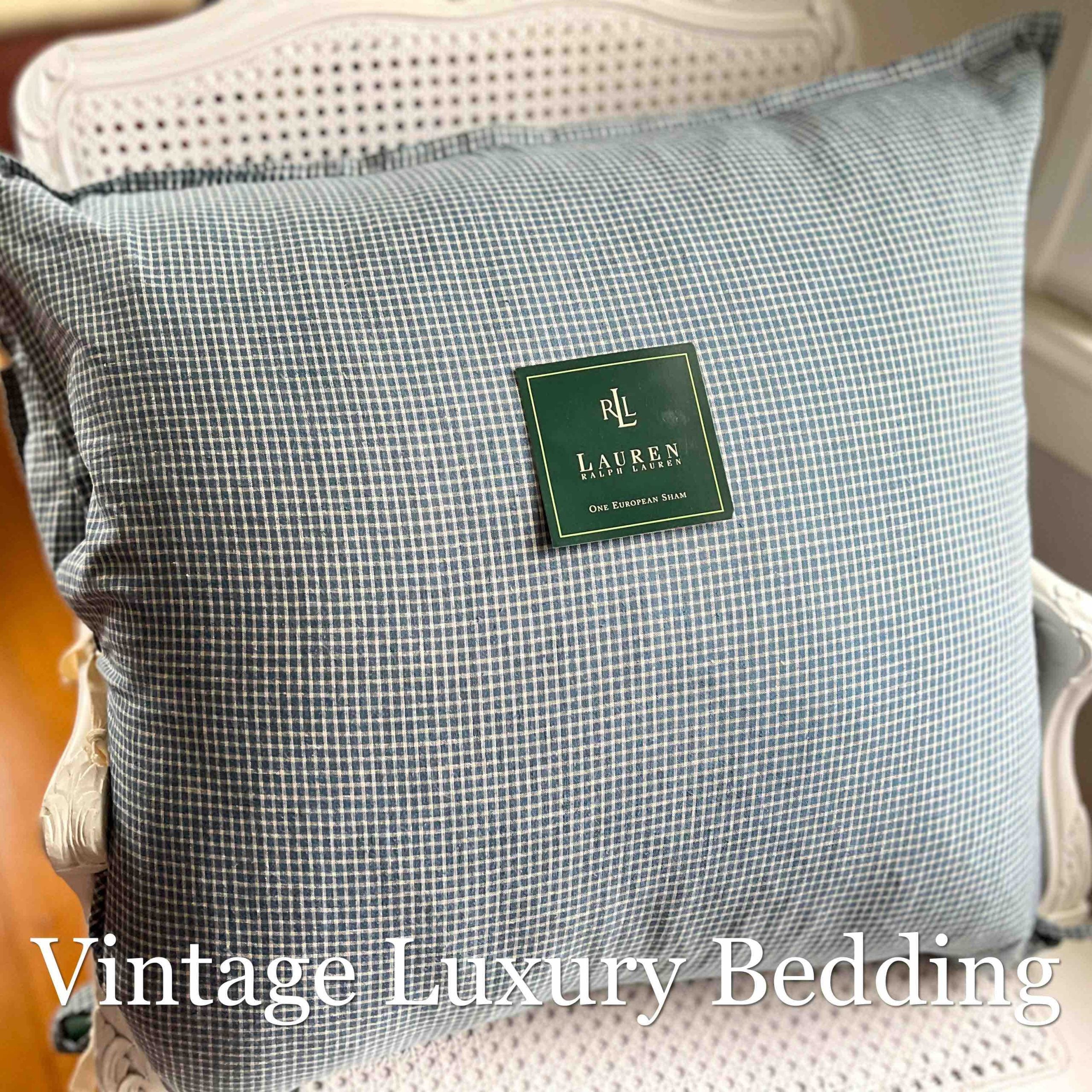 Ralph Lauren Chadwick Blue Check European pillow sham displayed upright on a cane-back chair.