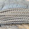 Close-up of the denim and white striped piping on the Ralph Lauren Chadwick Blue Patchwork Quilt