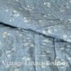 Close-up shot of the reverse side of the Ralph Lauren Chadwick Blue Patchwork Quilt showing denim fabric with tiny white flowers