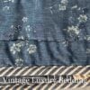 Close-up of the reverse side of the Ralph Lauren Chadwick Blue Patchwork Quilt showing denim fabric with small white flowers