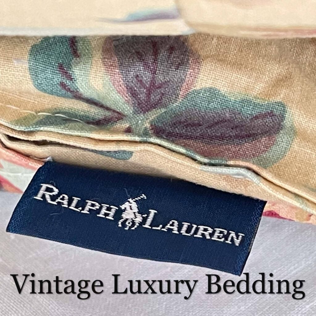 Top-down close-up of the Ralph Lauren Elsa Grassland comforter tag showing size, fabric content, and care instructions.