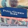 Close-up of the authentic Ralph Lauren Home blue tag on the Elsa Grassland queen comforter, showing vintage labeling and fabric details.