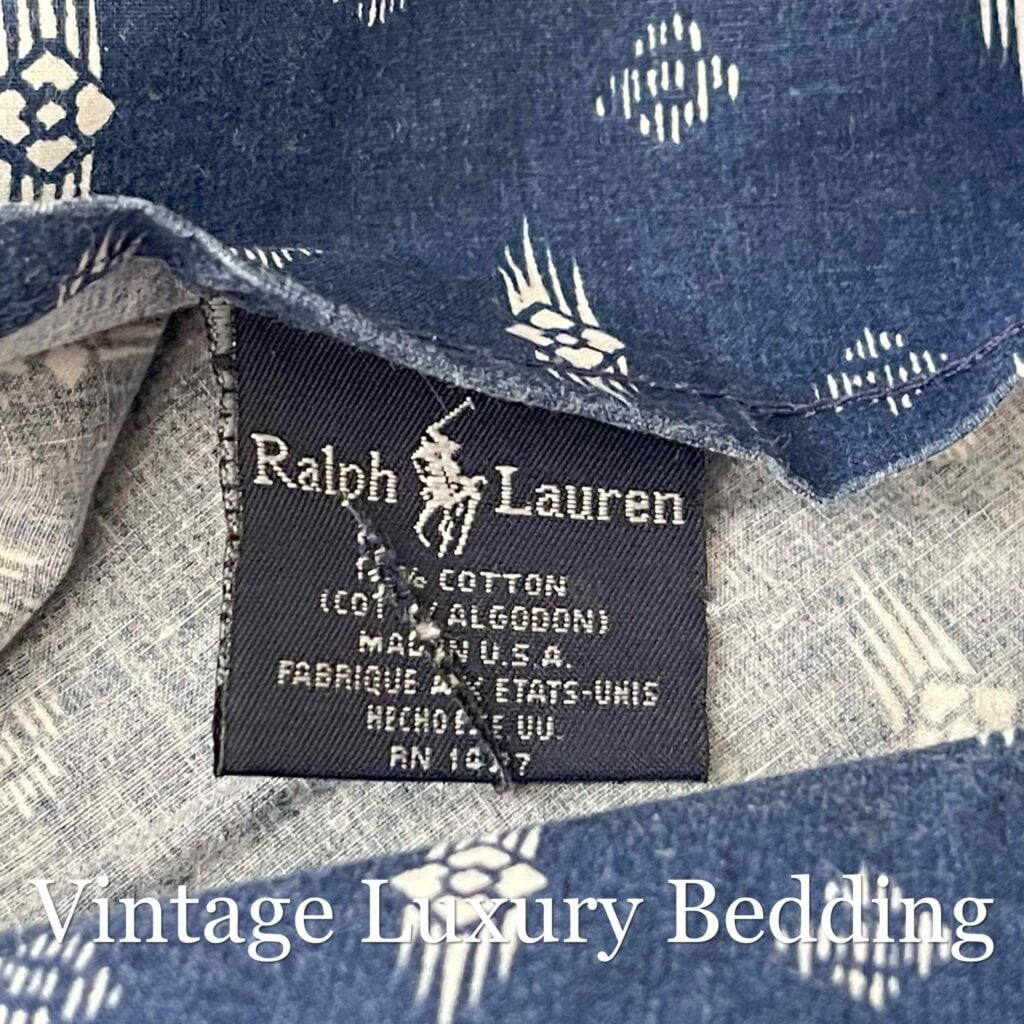 Close-up of black Ralph Lauren fabric tag on Shelley Indigo queen flat sheet