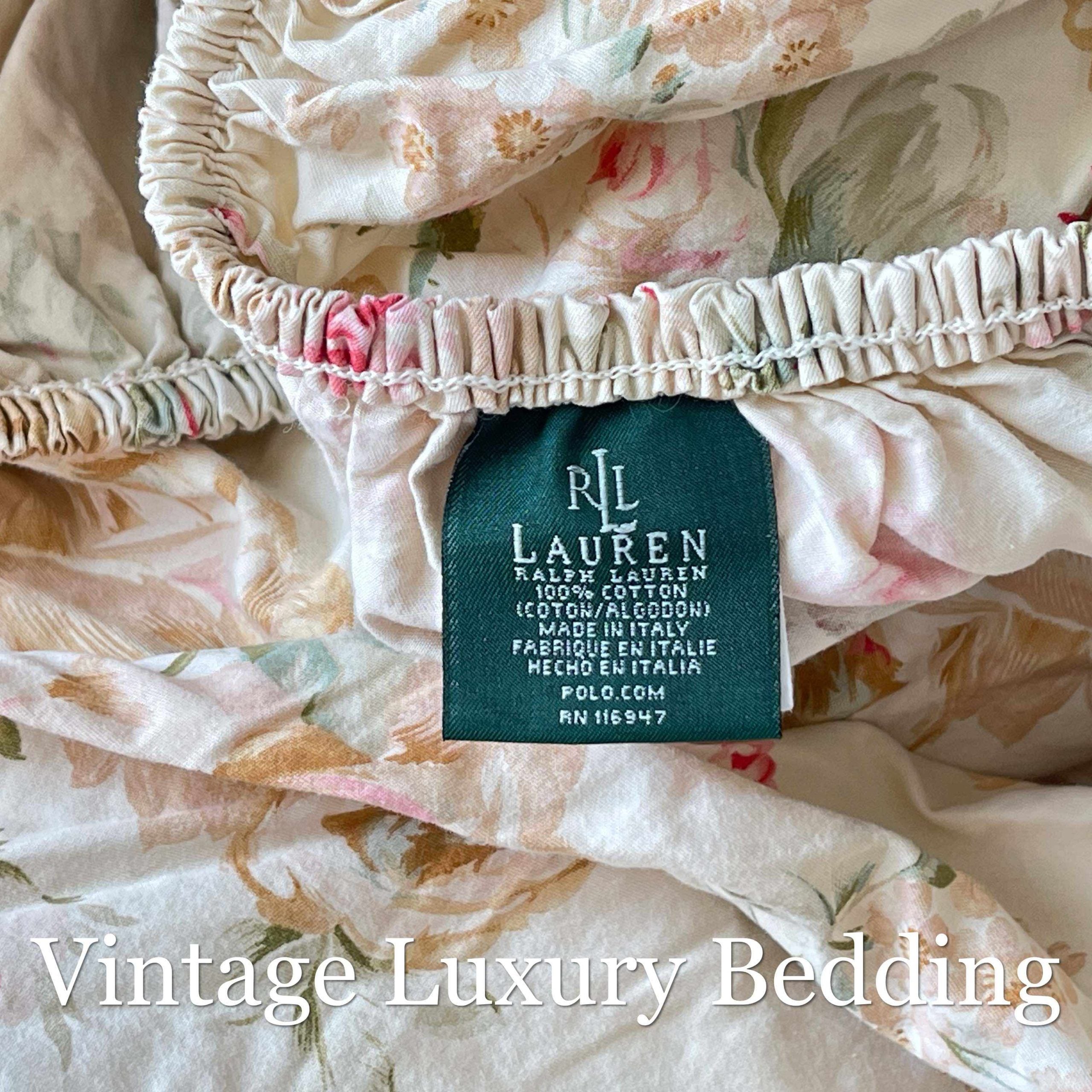 Top-down close-up of the Ralph Lauren Woodstock California king fitted sheet showing the pattern and the Ralph Lauren authentic tag.