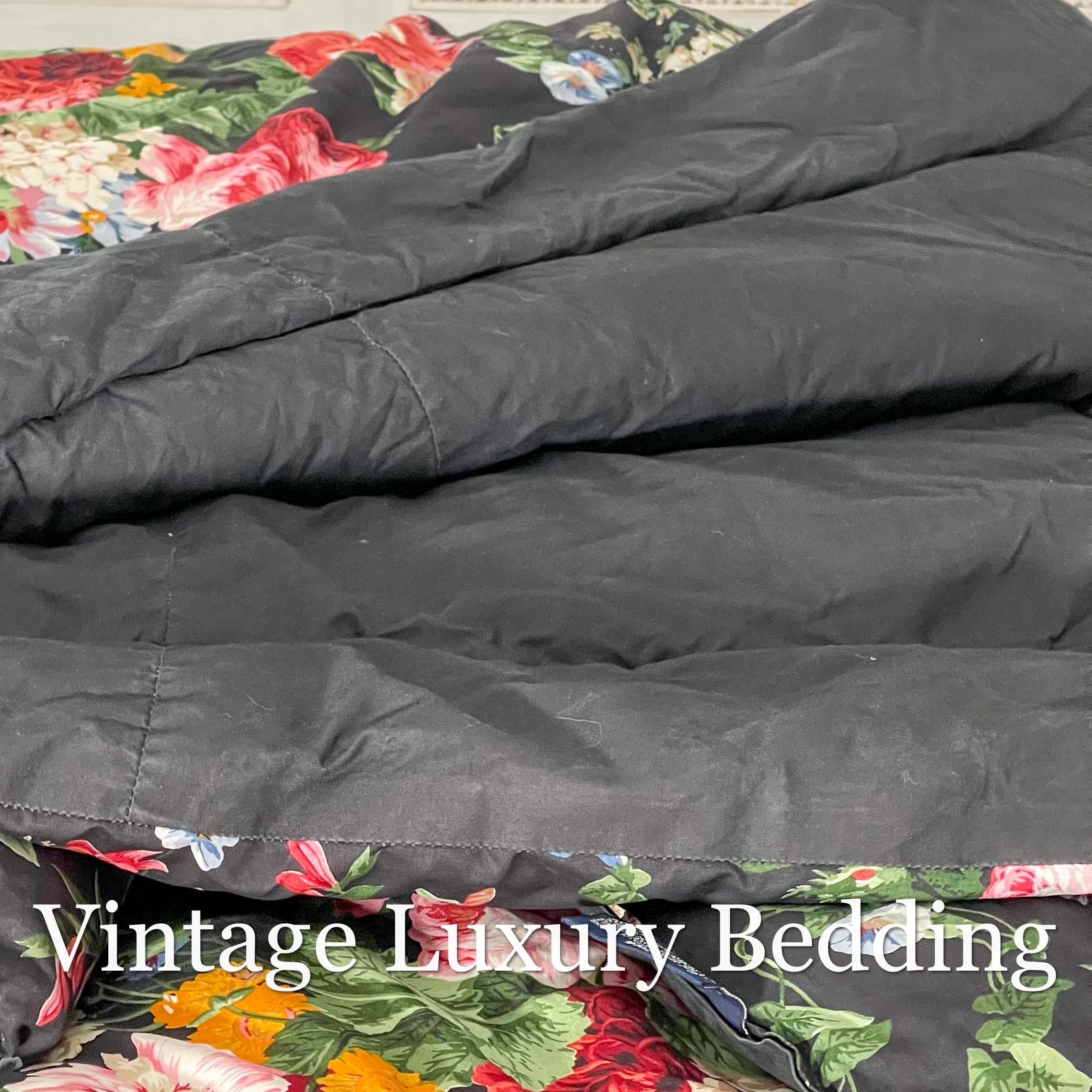 Side shot of the rare retired Ralph Lauren Isadora Collection Cossette Floral king comforter from the Ralph Lauren Home line, showing the solid black cotton reverse side folded over the floral pattern.