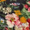 Top-down close-up of the rare retired Ralph Lauren Isadora Collection Cossette Floral king comforter from the Ralph Lauren Home line, showing bright pink, red, and white peonies and roses with blue, pink, orange, white, and lavender wildflowers on a deep black background.