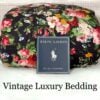 Front view of the rare retired Ralph Lauren Isadora Collection Cossette Floral king comforter from the Ralph Lauren Home line, folded and rolled with the Ralph Lauren placard in front.