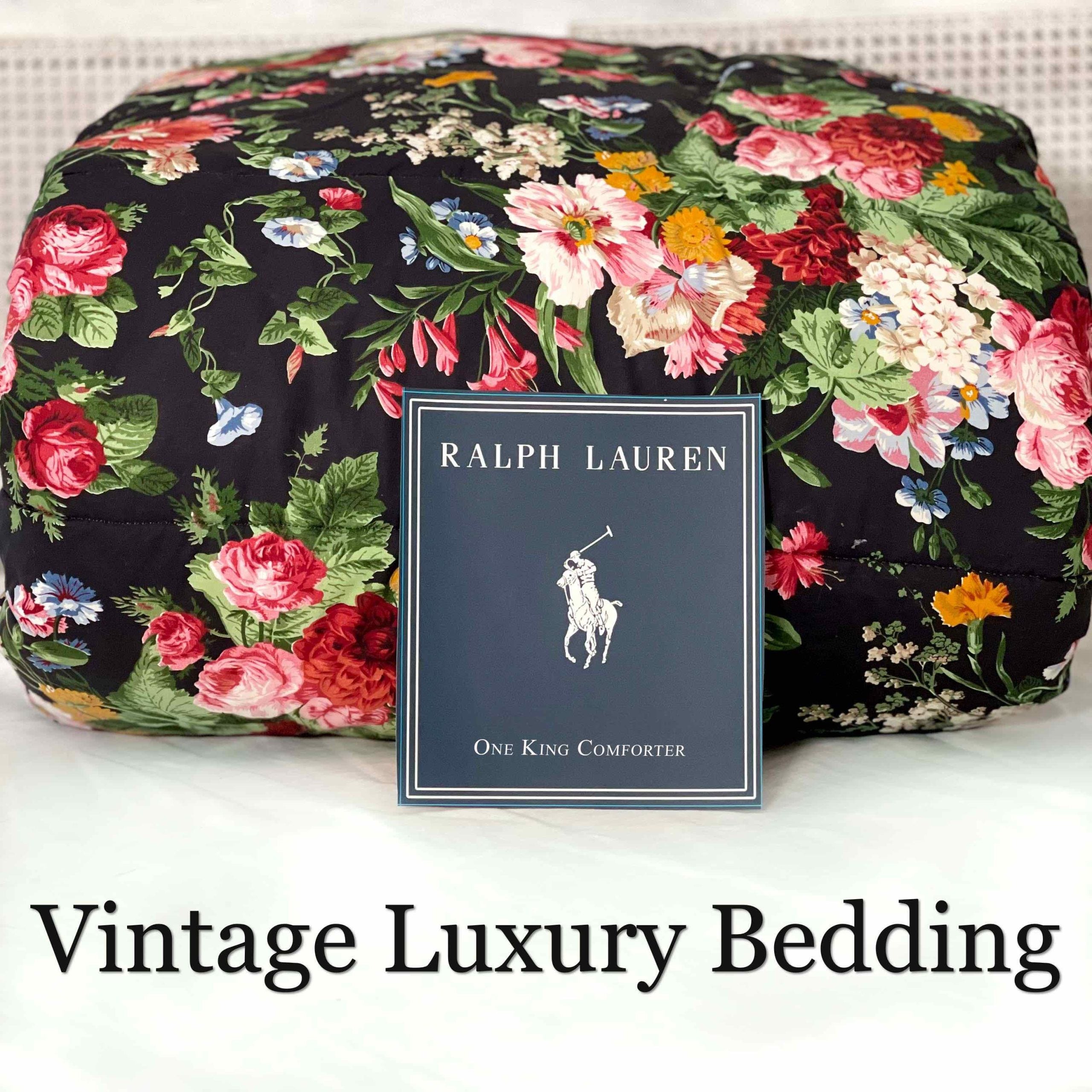 Front view of the rare retired Ralph Lauren Isadora Collection Cossette Floral king comforter from the Ralph Lauren Home line, folded and rolled with the Ralph Lauren placard in front.