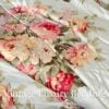 Side close-up of the rare retired Ralph Lauren Stone Harbor king comforter showing the pink, white, and pale yellow peonies with light blue, lavender, and white wildflowers on a pale aqua background, with the top stitching visible.
