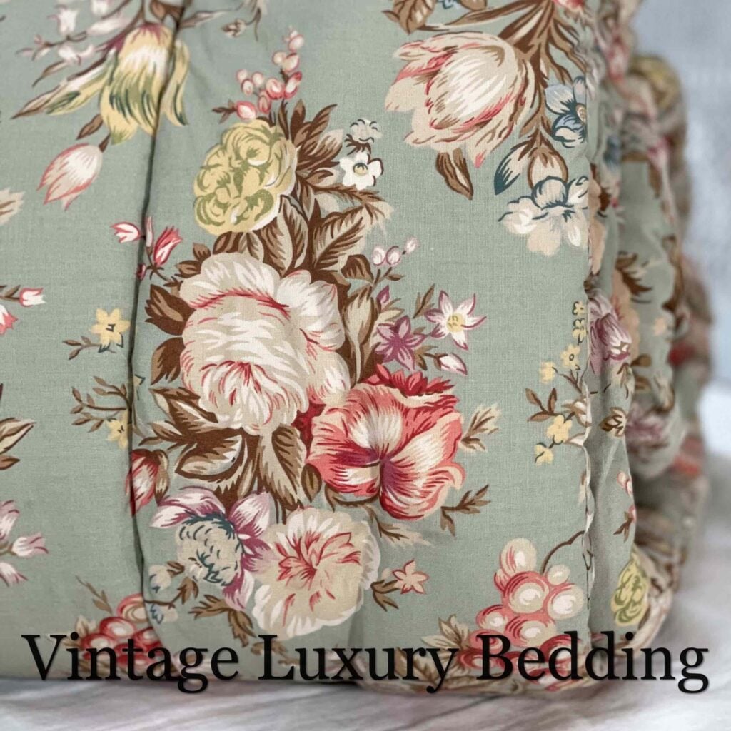 Side view of Ralph Lauren Charlotte comforter rolled up, highlighting floral pattern