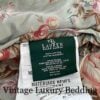 Super tight close-up of the front Ralph Lauren tag on the rare retired Charlotte comforter from the Ralph Lauren Home line, showing 100% cotton and Made in USA.