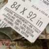 Close-up of the tag on the rare retired Ralph Lauren Charlotte queen comforter from the Ralph Lauren Home line, showing the 84x92 sizing.