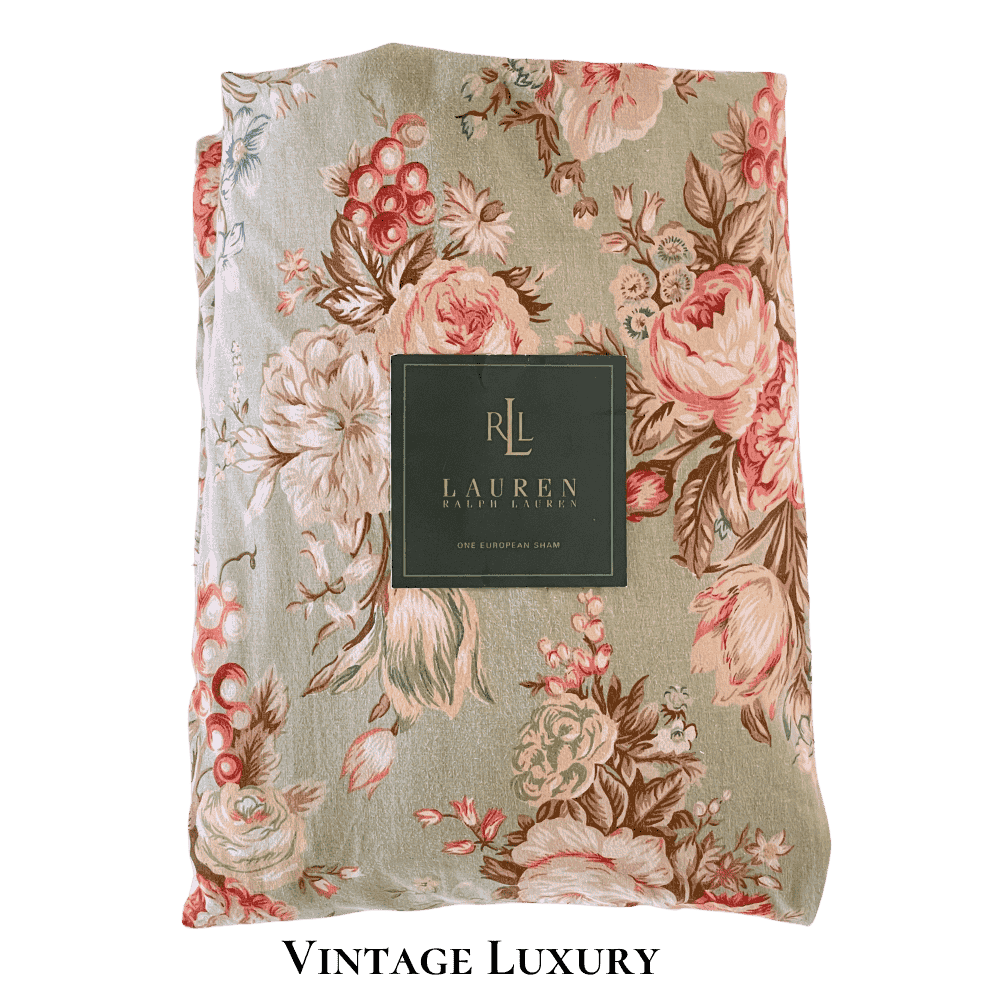Top-down shot of the rare retired Ralph Lauren Charlotte standard pillowcase from the Ralph Lauren Home line, neatly folded with the Ralph Lauren placard placed on top.