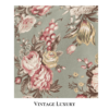 Top-down close-up of the rare retired Ralph Lauren Charlotte standard pillowcase from the Ralph Lauren Home line, showing the floral pattern with light red ranunculus, roses, peonies, and multicolored wildflowers on a sage green background, with the pillow inserted.
