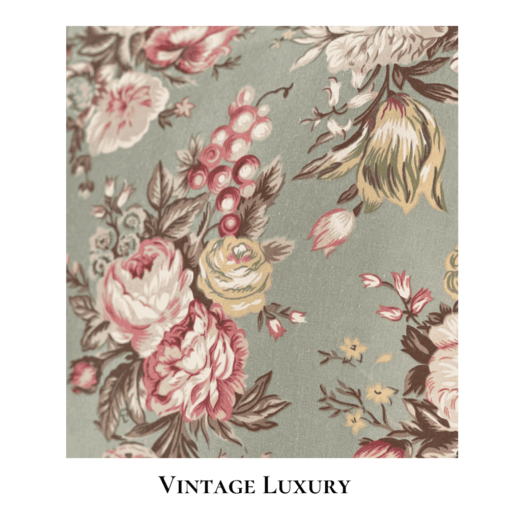 Top-down close-up of the rare retired Ralph Lauren Charlotte standard pillowcase from the Ralph Lauren Home line, showing the floral pattern with light red ranunculus, roses, peonies, and multicolored wildflowers on a sage green background, with the pillow inserted.