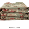 Side view of folded and stacked Ralph Lauren Charlotte sheets showcasing floral pattern