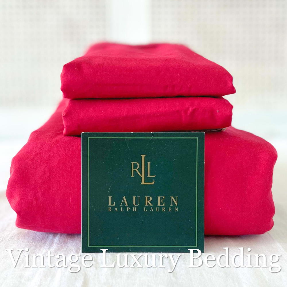 Side view of neatly folded vintage Ralph Lauren Barn Red King sheet set