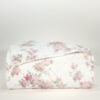 Front view of nearly folded Simply Shabby Chic pink top-stitched cotton king quilt with rose floral pattern