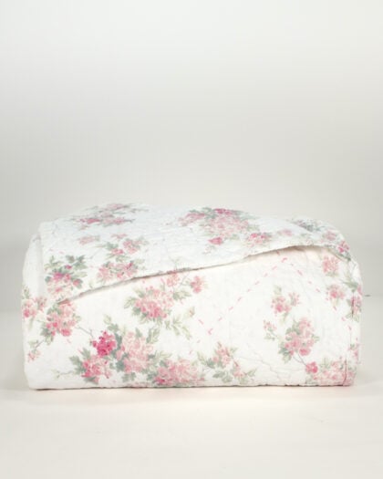 Front view of nearly folded Simply Shabby Chic pink top-stitched cotton king quilt with rose floral pattern
