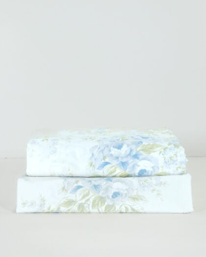 Front side view of a neatly folded and stacked pair of Simply Shabby Chic British Rose 14 by 86 inch valances