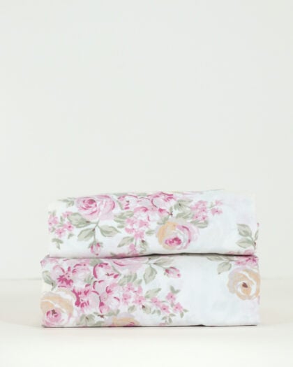 Front view of a neatly stacked pair of Simply Shabby Chic Blush Beauty 31 by 56 inch valances