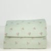 Pair of folded Simply Shabby Chic standard pillowcases in soft sage green with tiny pink and blue ditsy flowers