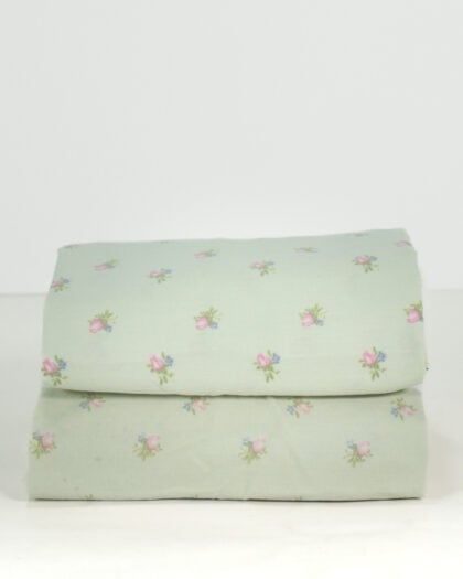 Pair of folded Simply Shabby Chic standard pillowcases in soft sage green with tiny pink and blue ditsy flowers