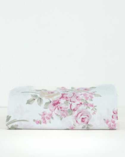 Side view of a neatly folded Simply Shabby Chic Blush Beauty 26 by 120 inch wide single valance