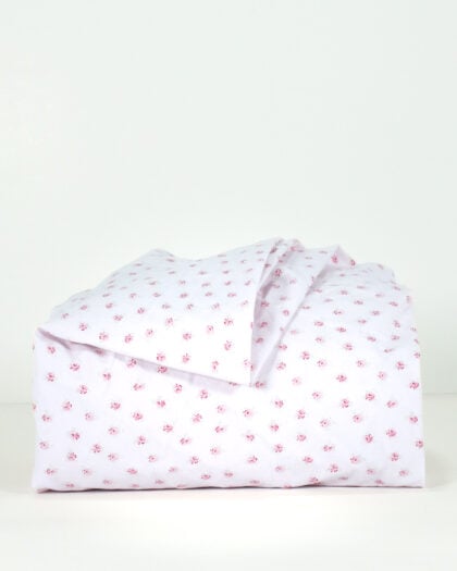Side view of a Simply Shabby Chic Target-era Candy Cane Floral full flat sheet in cotton with a pink background and delicate floral print