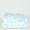 Side view of a Simply Shabby Chic Target-era Candy Cane Floral full flat sheet in cotton with a white background and soft pink and blue floral print