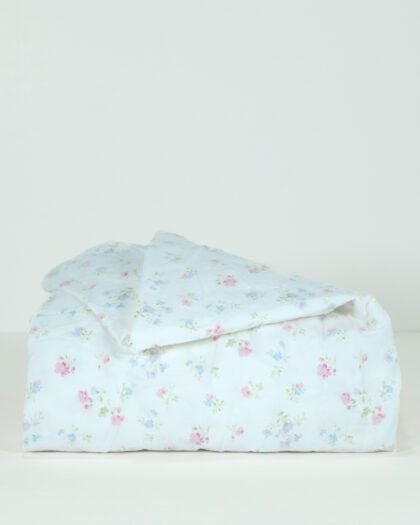 Side view of a Simply Shabby Chic Target-era Candy Cane Floral full fitted sheet in cotton with a white background and soft pink and blue floral print