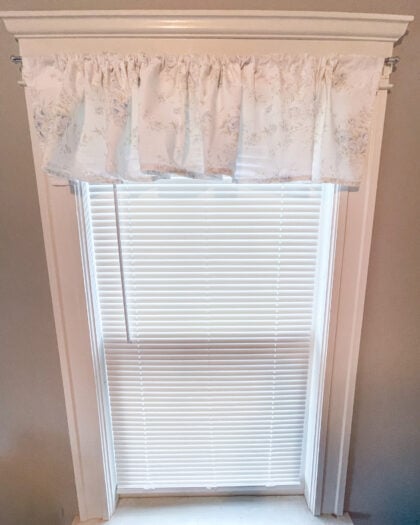 Front view of Simply Shabby Chic British Rose pair of 14 by 86 inch valances hanging on a window as classic window toppers