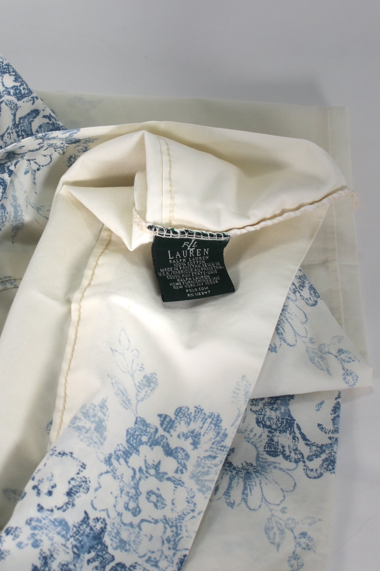 Close-up of blue Ralph Lauren Home tag on vintage Catalina Island standard pillowcases