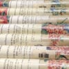 multiple Katzenbach and Warren floral wallpaper rolls grouped together same dye lot