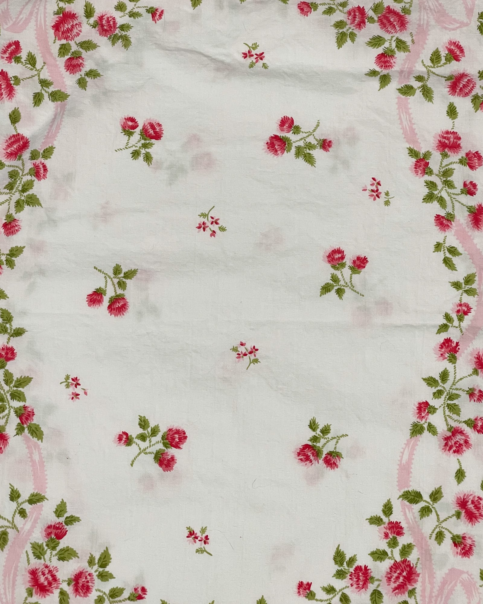 Wide pattern view of vintage Springmaid Muslin pillowcase with red wildflowers and green foliage