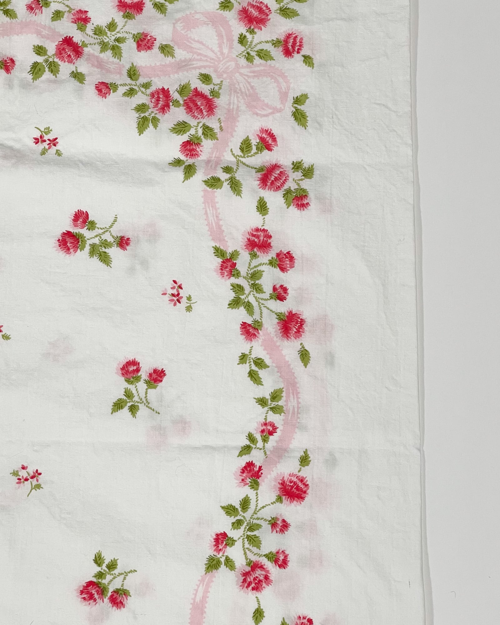 Medium close-up of red wildflower pattern on vintage Springmaid Muslin pillowcase